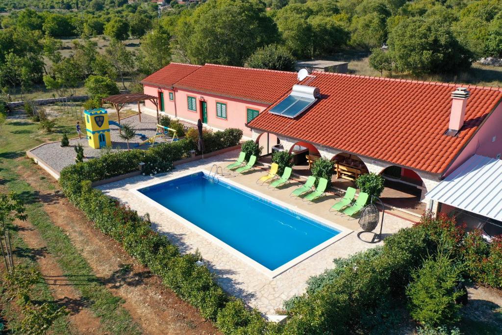 an aerial view of a house with a swimming pool at Villa Lujko in Prapatnica