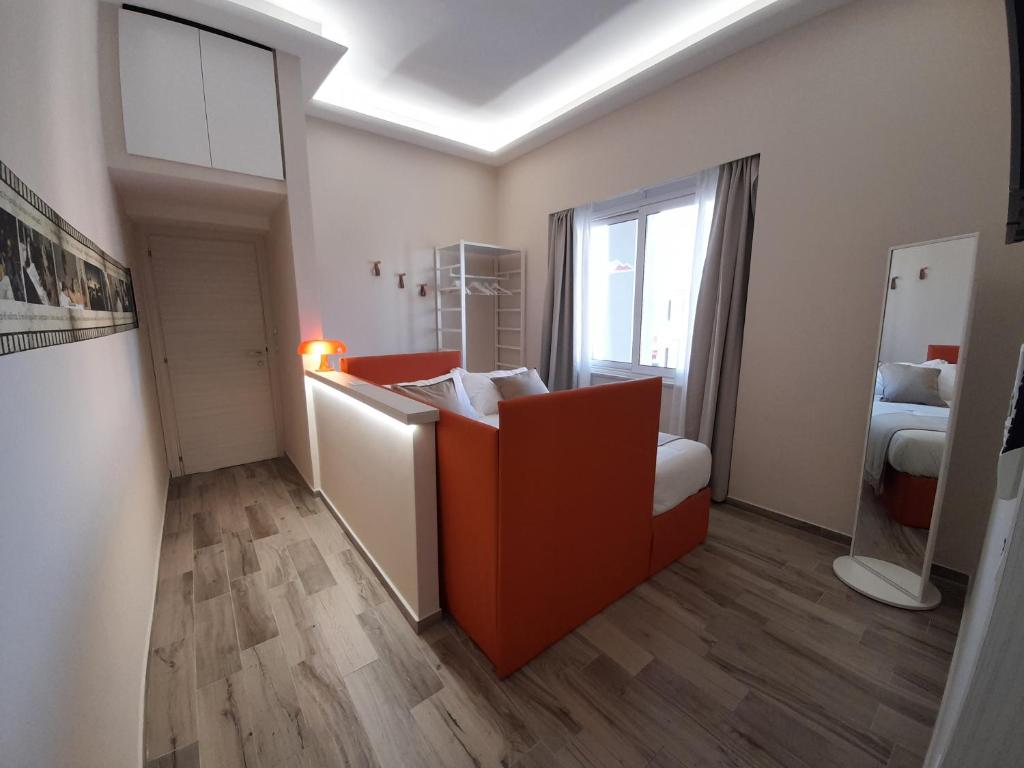 Łóżko lub łóżka w pokoju w obiekcie ARCO VESUVIANO