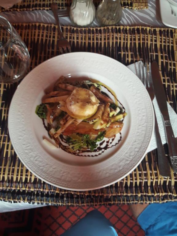 a white plate of food on a table at Sahara Desert Trips & Camps in Merzouga