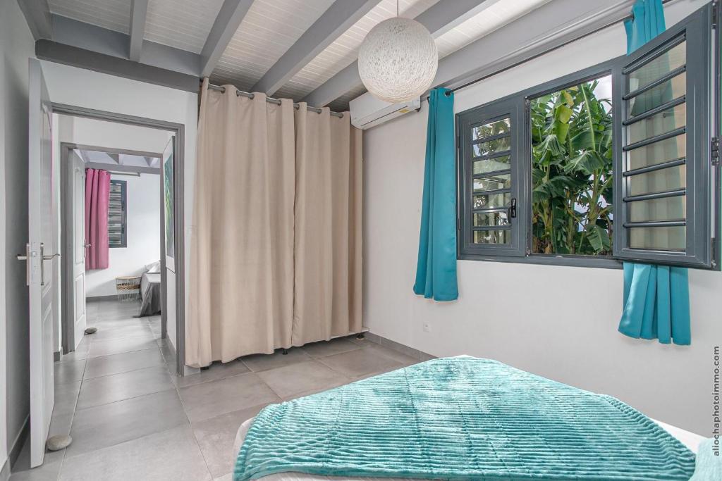 Postel nebo postele na pokoji v ubytování Villa Mabélo