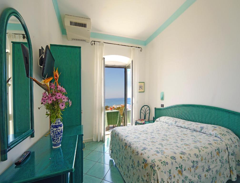 Postel nebo postele na pokoji v ubytování Hotel Casa del Sole
