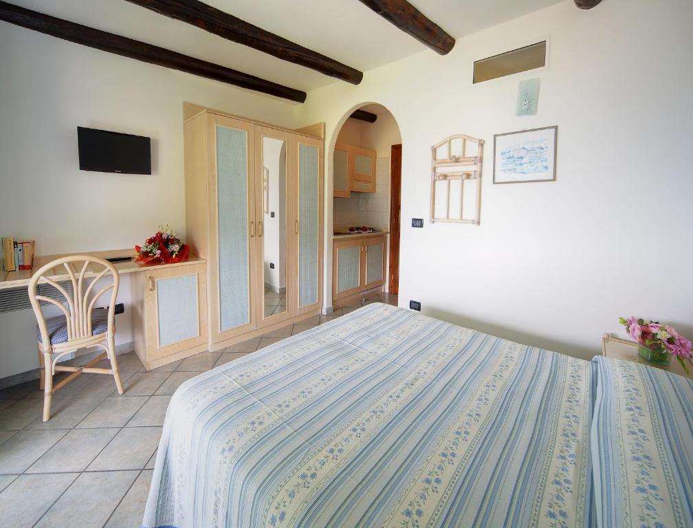 Postel nebo postele na pokoji v ubytování Hotel Casa del Sole