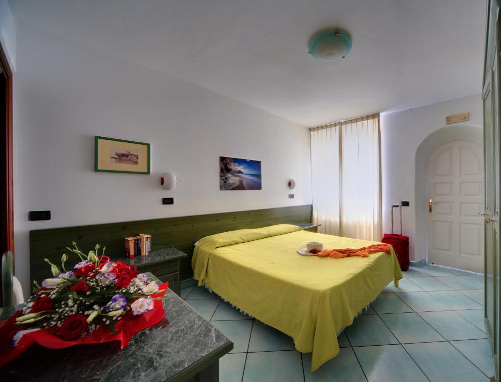 Postel nebo postele na pokoji v ubytování Hotel Casa del Sole