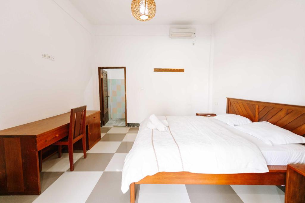 Uma cama ou camas num quarto em Dream CoWork Hotel