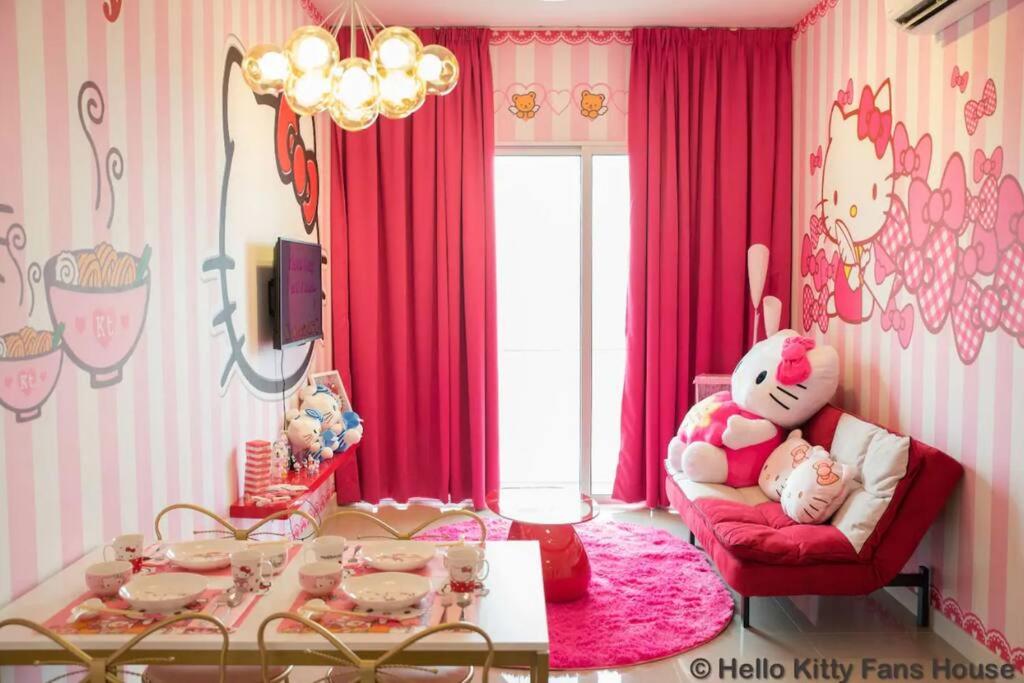 a childs room with pink curtains and a red chair at Play at HELLO KITTY Kawaii Fun House in Kuala Lumpur