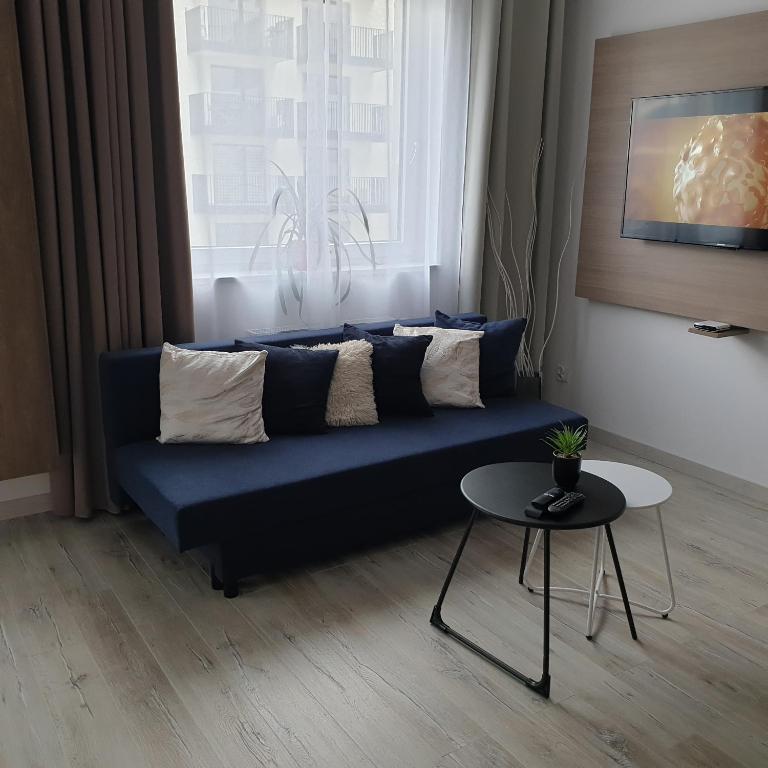 Posezení v ubytování Q Apart SILVER -klimatyzowane STUDIO przy Manufakturze z garażem Gratis, FV