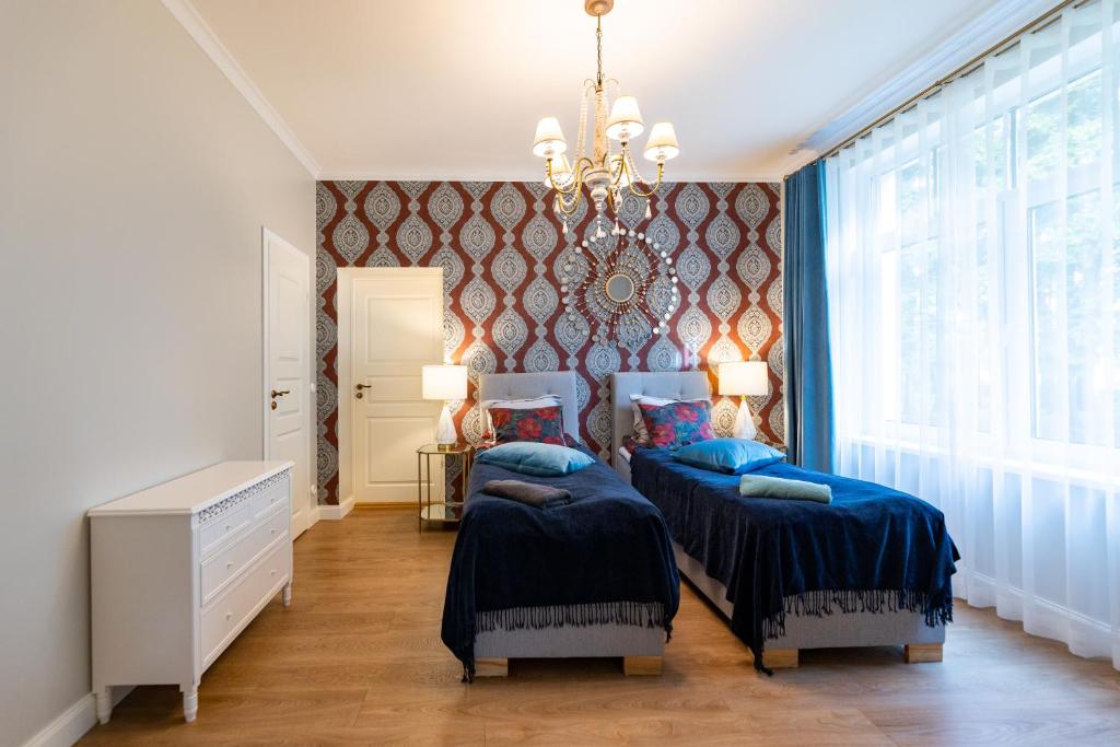 Postel nebo postele na pokoji v ubytování Tiismani Villa
