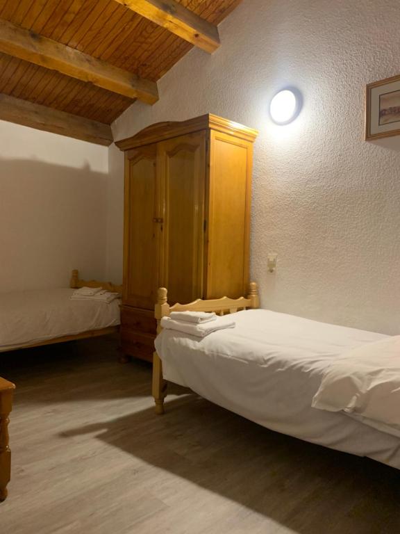 Postel nebo postele na pokoji v ubytování ABELLETES - K31 DeuSol - Vall d'Incles - Soldeu Hut 6057