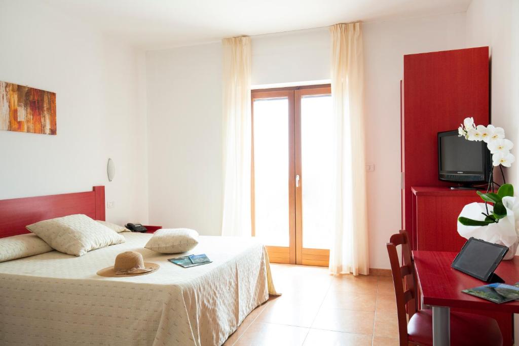 Postel nebo postele na pokoji v ubytování Hotel Delle More