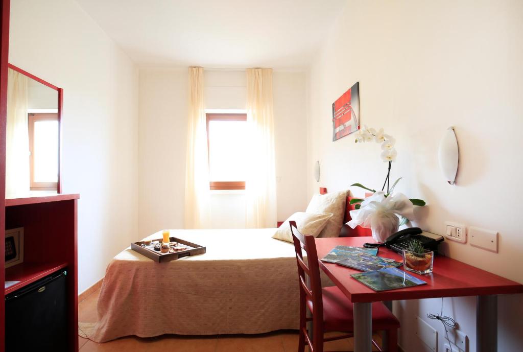 Postel nebo postele na pokoji v ubytování Hotel Delle More