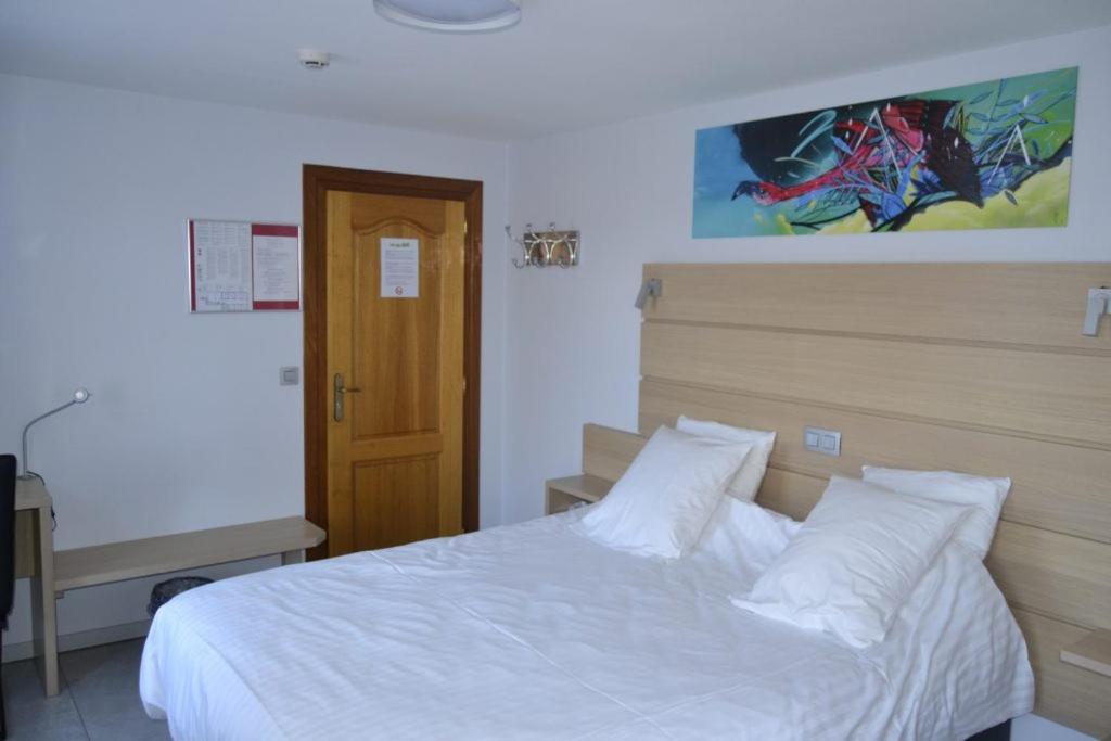 Postel nebo postele na pokoji v ubytování Hotel Beau Site