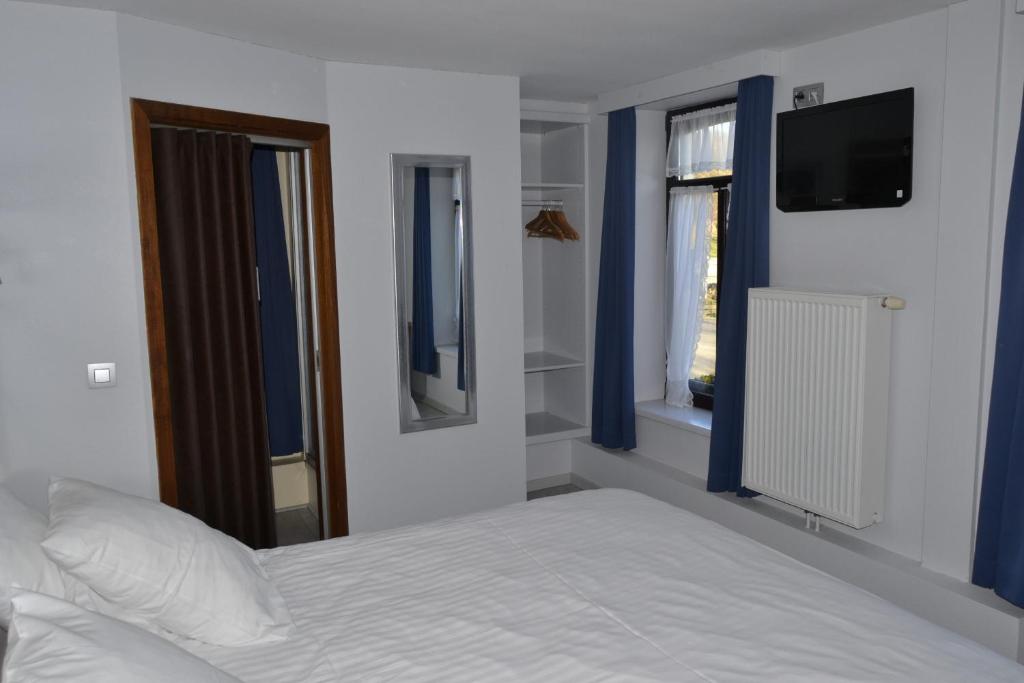 Postel nebo postele na pokoji v ubytování Hotel Beau Site