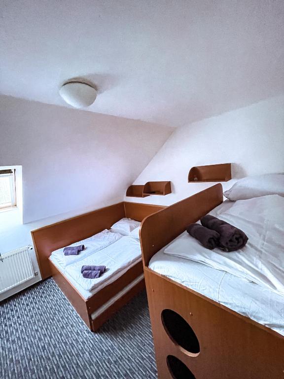 Postel nebo postele na pokoji v ubytování Penzion Rollba