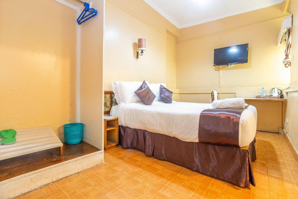 Postel nebo postele na pokoji v ubytování Impala Hotel Parklands
