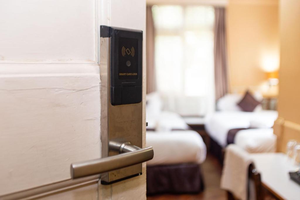 Postel nebo postele na pokoji v ubytování Impala Hotel Parklands
