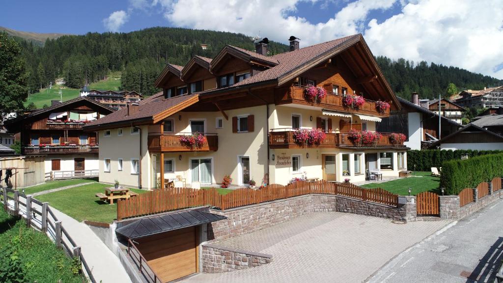 a large house with balconies on the side of it at Residence Kramhuter in Sesto