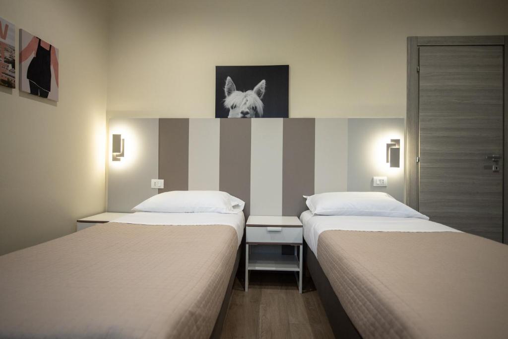 Postel nebo postele na pokoji v ubytování Le PALME