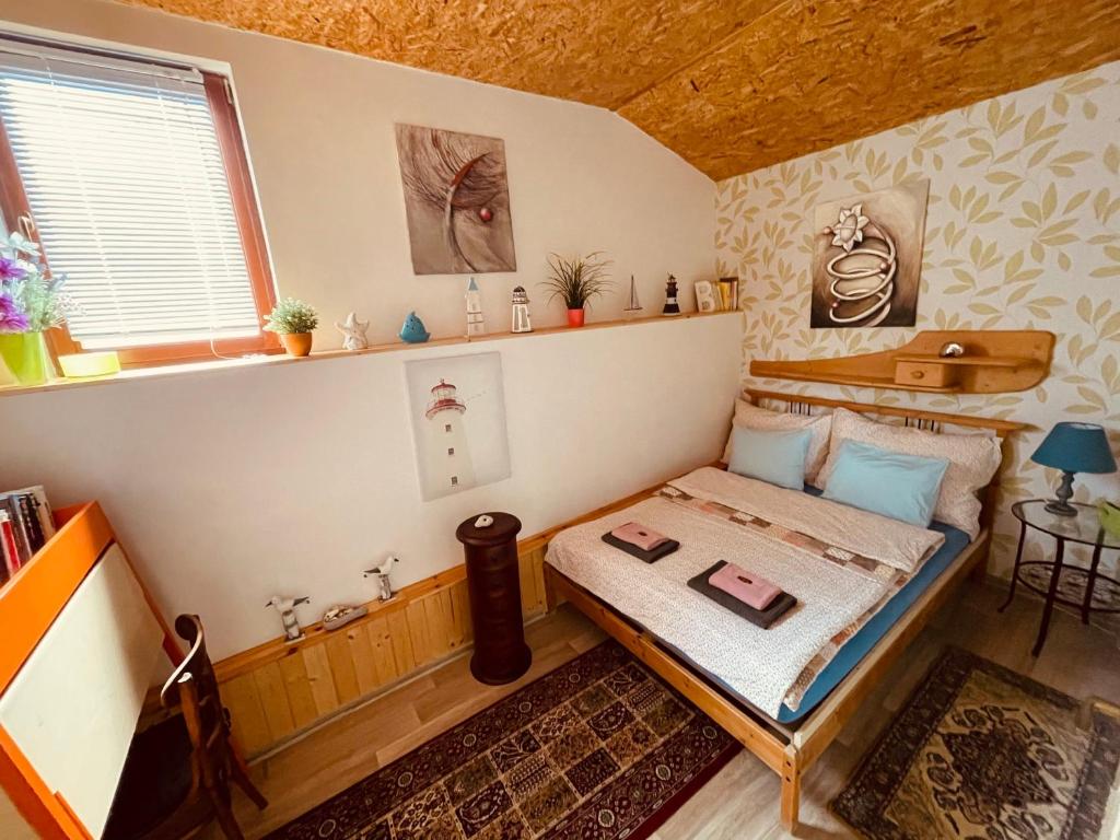 Postel nebo postele na pokoji v ubytování Apartmány U kapličky