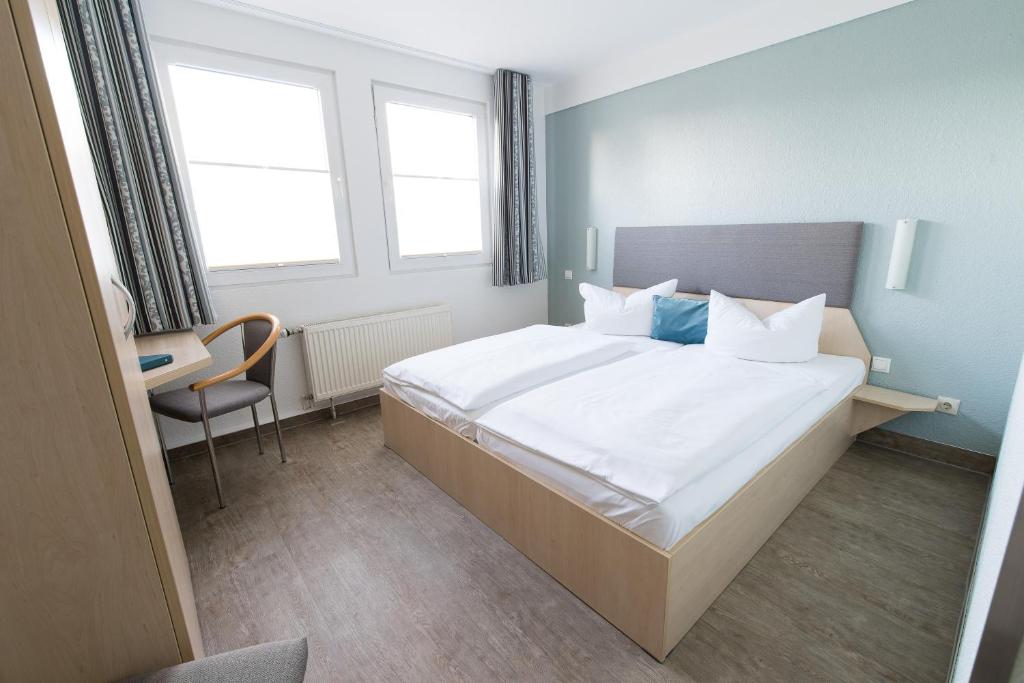 Postel nebo postele na pokoji v ubytování Rosen-Hotel