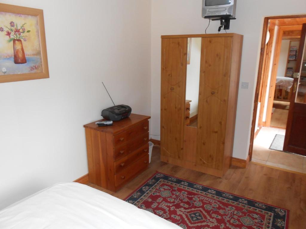 Postel nebo postele na pokoji v ubytování Birchdale Cottage