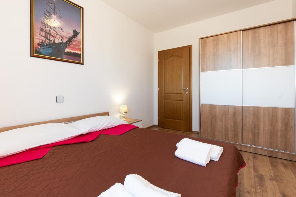 Postel nebo postele na pokoji v ubytování La Vista apartments with pool