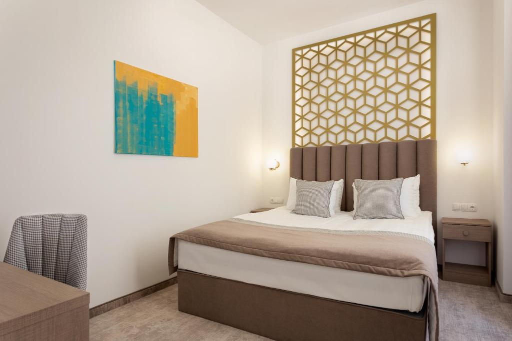 Posteľ alebo postele v izbe v ubytovaní Mera Hotel