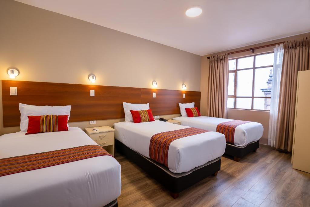 Кровать или кровати в номере Hotel San Pedro Plaza
