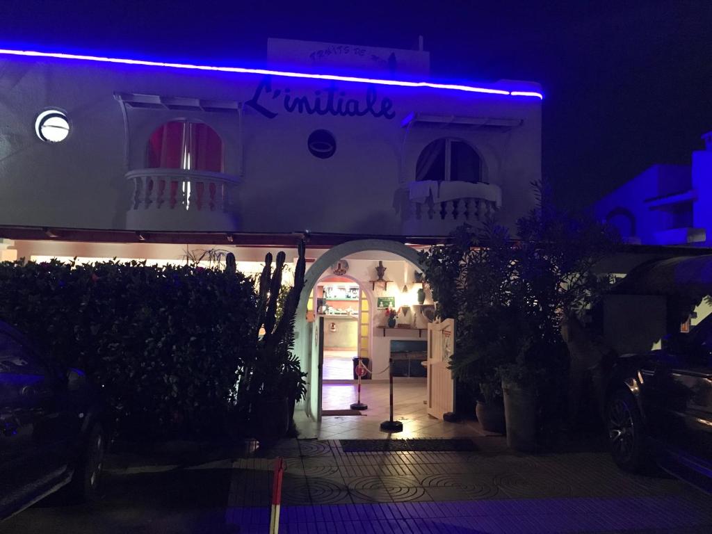 a building with a blue light on top of it at Hotel L'Initiale in Oualidia
