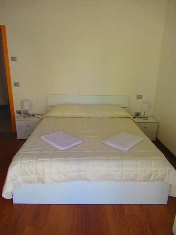 Łóżko lub łóżka w pokoju w obiekcie Casa Mirella