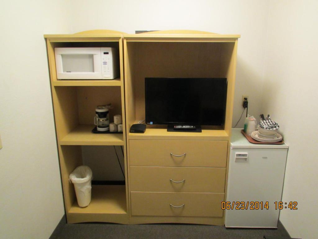 Kuchyň nebo kuchyňský kout v ubytování Lazy J Motel