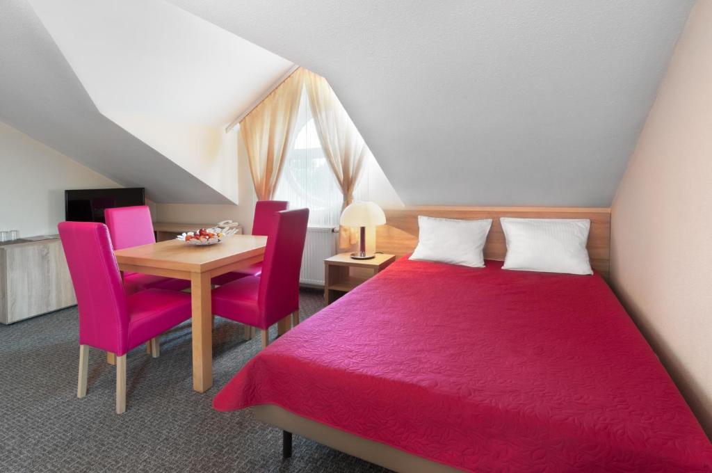 Posteľ alebo postele v izbe v ubytovaní Hotel Petrus