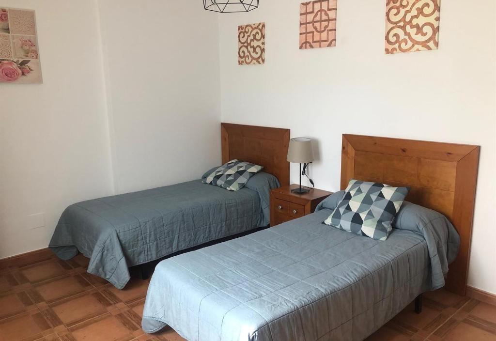 Postel nebo postele na pokoji v ubytování Casa Olivia
