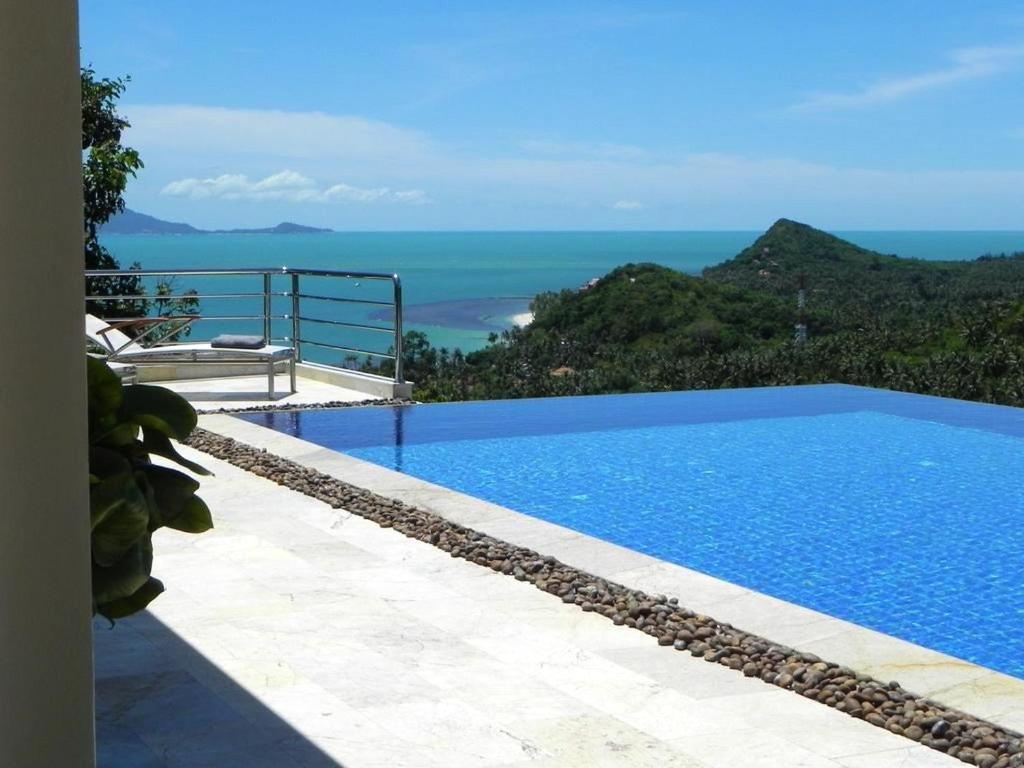 a swimming pool with a view of the ocean at 3 bedrooms villa at Tambon Mae Nam 500 m away from the beach with sea view private pool and furnished terrace in Ban Bang Po