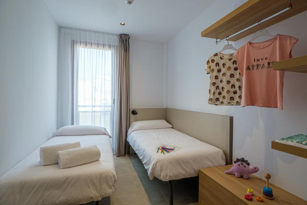 Postel nebo postele na pokoji v ubytování Tgna Reial 1