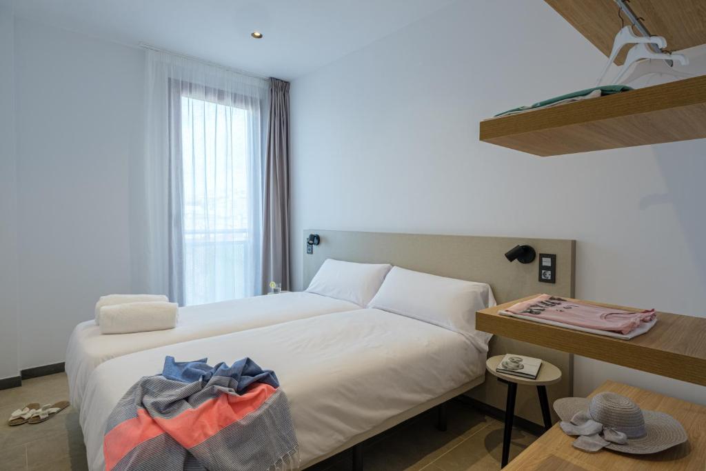 Postel nebo postele na pokoji v ubytování Tgna Reial 1