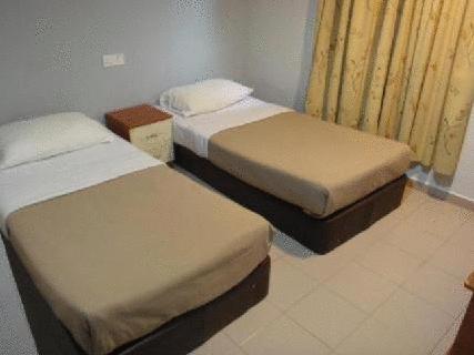 Postel nebo postele na pokoji v ubytování Tiong Nam Hotel