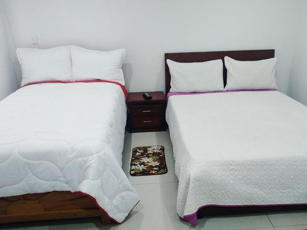 Postel nebo postele na pokoji v ubytování Stay In Bogota