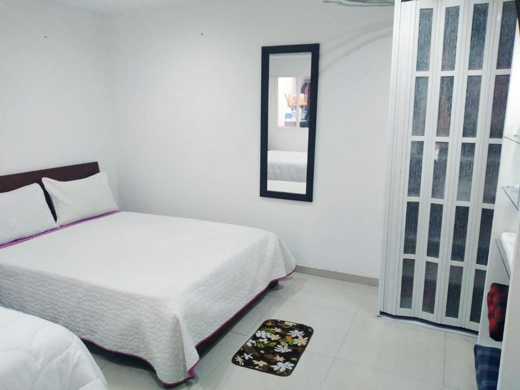Postel nebo postele na pokoji v ubytování Stay In Bogota