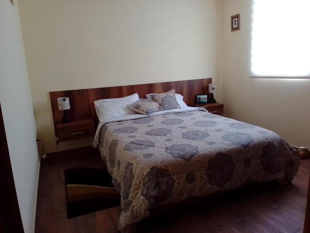 Postel nebo postele na pokoji v ubytování Apart Cayambe
