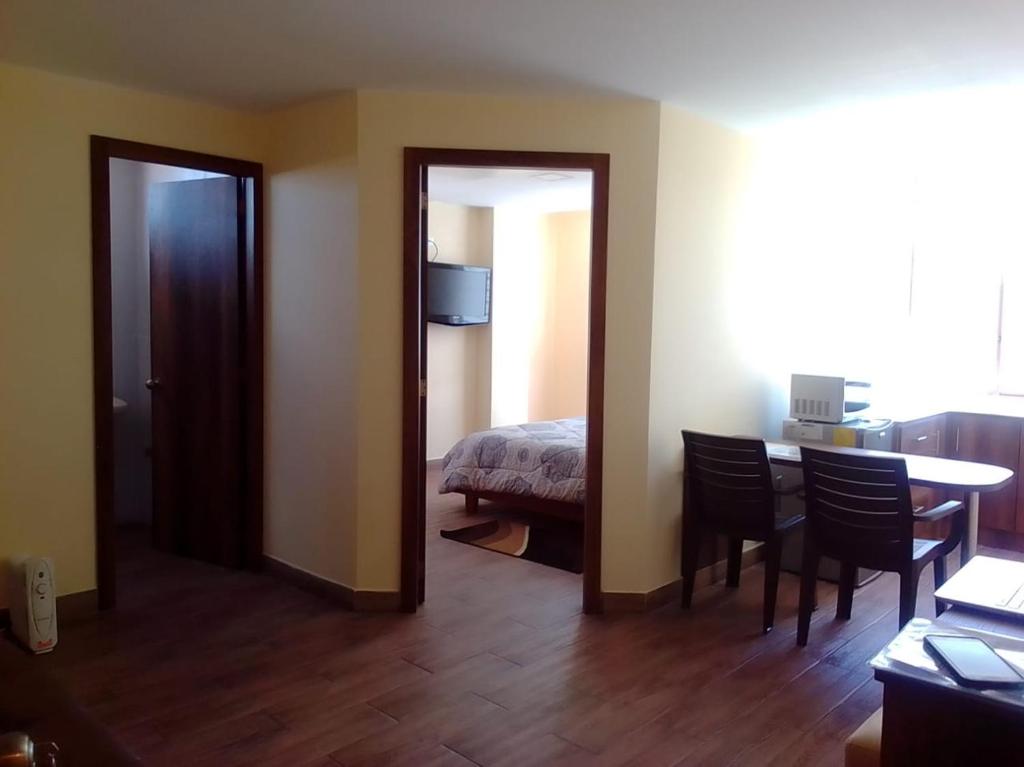 Postel nebo postele na pokoji v ubytování Apart Cayambe