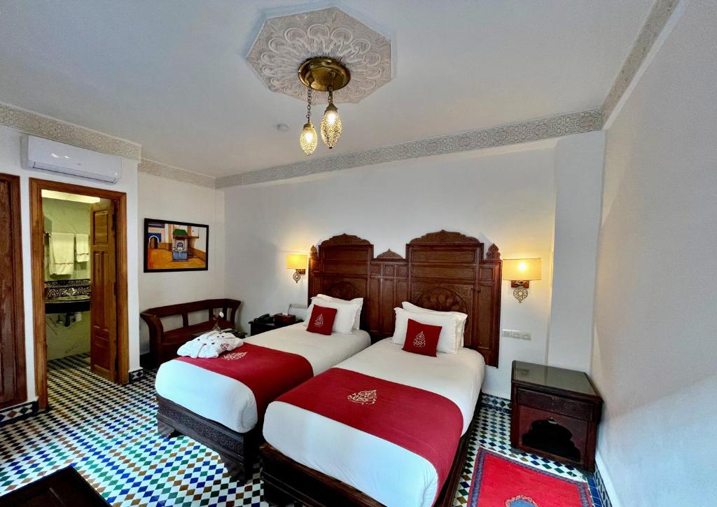 Postel nebo postele na pokoji v ubytování Riad Marjana suites & Spa