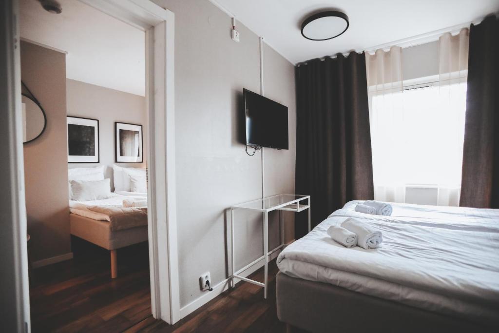 Postel nebo postele na pokoji v ubytování Siljansnäs Hotell