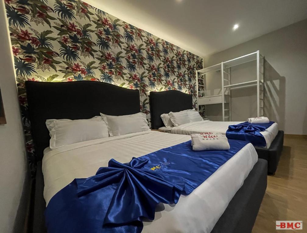 Postel nebo postele na pokoji v ubytování BMC Hotel