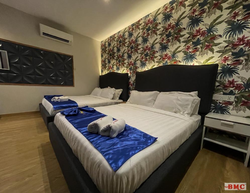 Postel nebo postele na pokoji v ubytování BMC Hotel