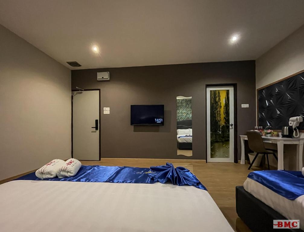 Postel nebo postele na pokoji v ubytování BMC Hotel