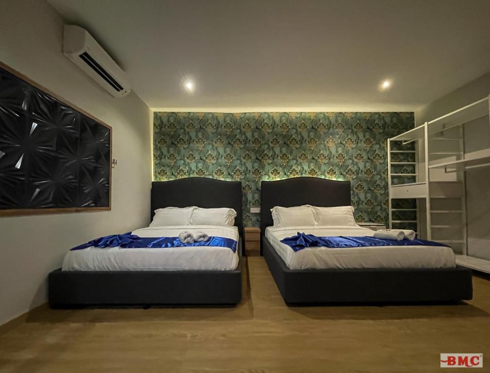 Postel nebo postele na pokoji v ubytování BMC Hotel