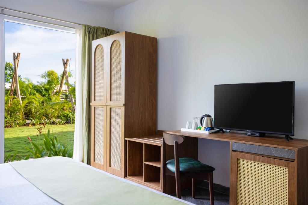 TV a/nebo společenská místnost v ubytování Sibaya Beach Resort, Morjim