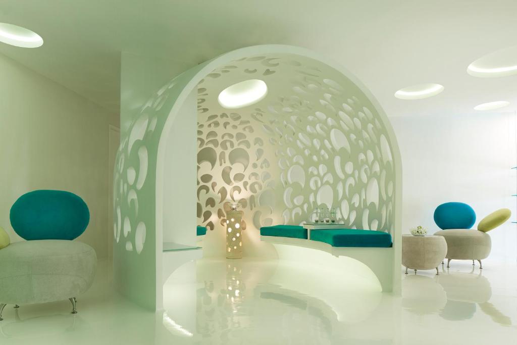 a living room with two chairs and a table at Double - Six, Luxury Hotel - Seminyak in Seminyak