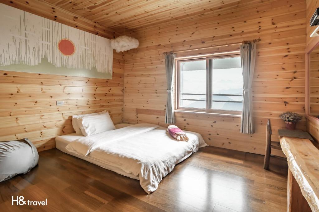 Postel nebo postele na pokoji v ubytování Alishan Sunrise B&B