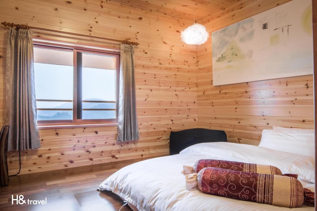 Postel nebo postele na pokoji v ubytování Alishan Sunrise B&B